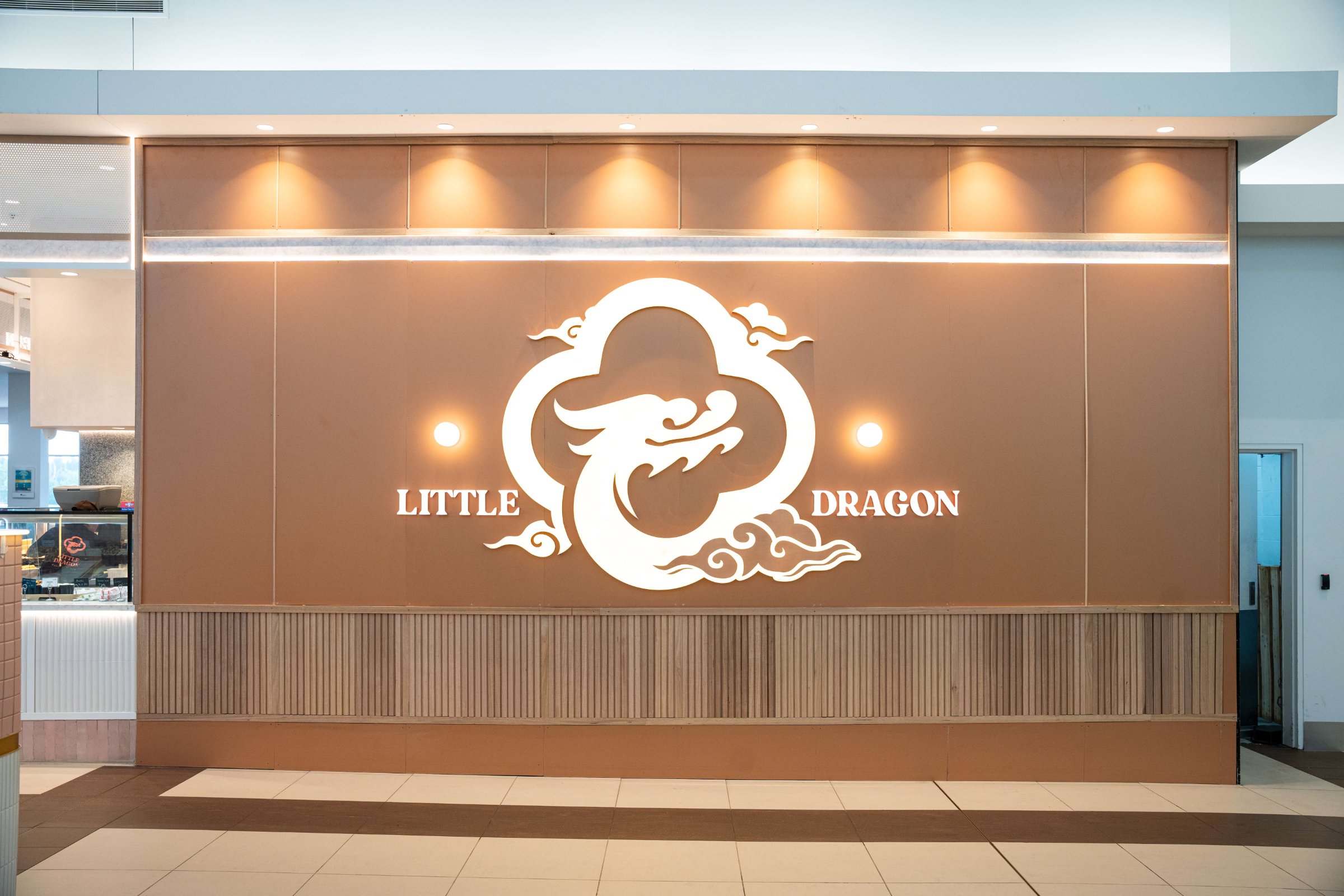 Little Dragon — illuminated logo wall, Caroline Springs